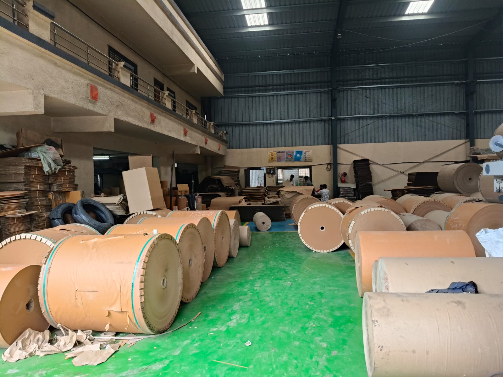 Shivani Packaging wide warehouse interior with paper rolls