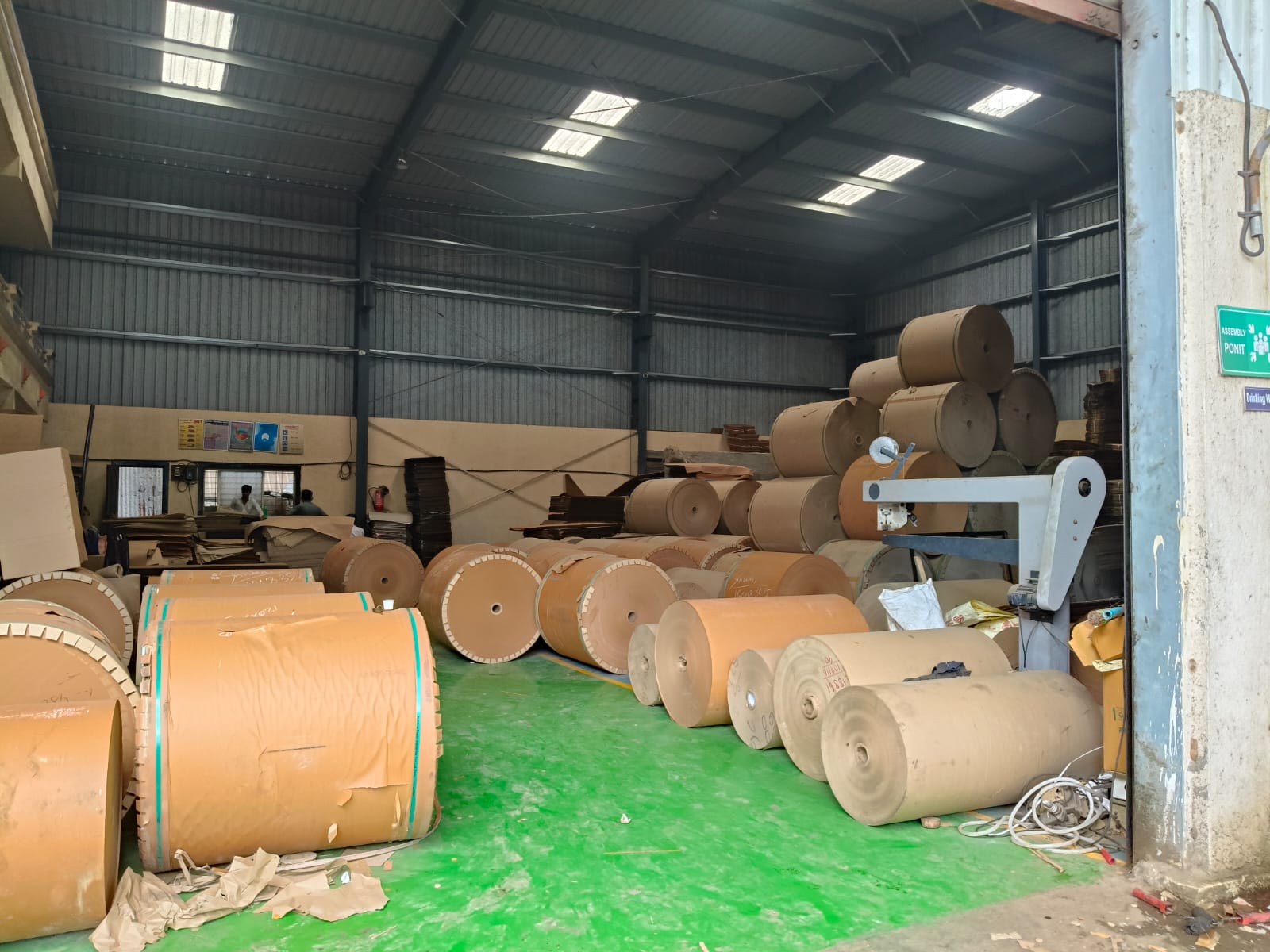 Shivani Packaging warehouse interior with large paper rolls
